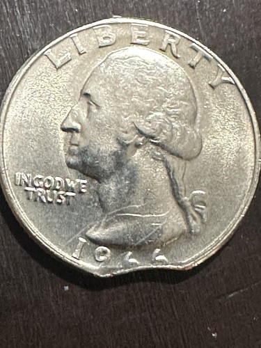 1966 quarter struck on cent planchet showing reddish-bronze color and smaller planchet with outer design truncated