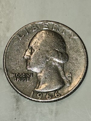 1966 Washington quarter struck-through error showing raised irregular impression on Washington portrait where foreign debris was caught between die and planchet